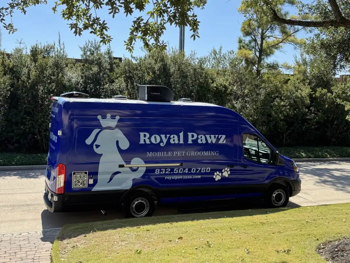 Royal Pawz mobile dog grooming van parked in a Houston driveway